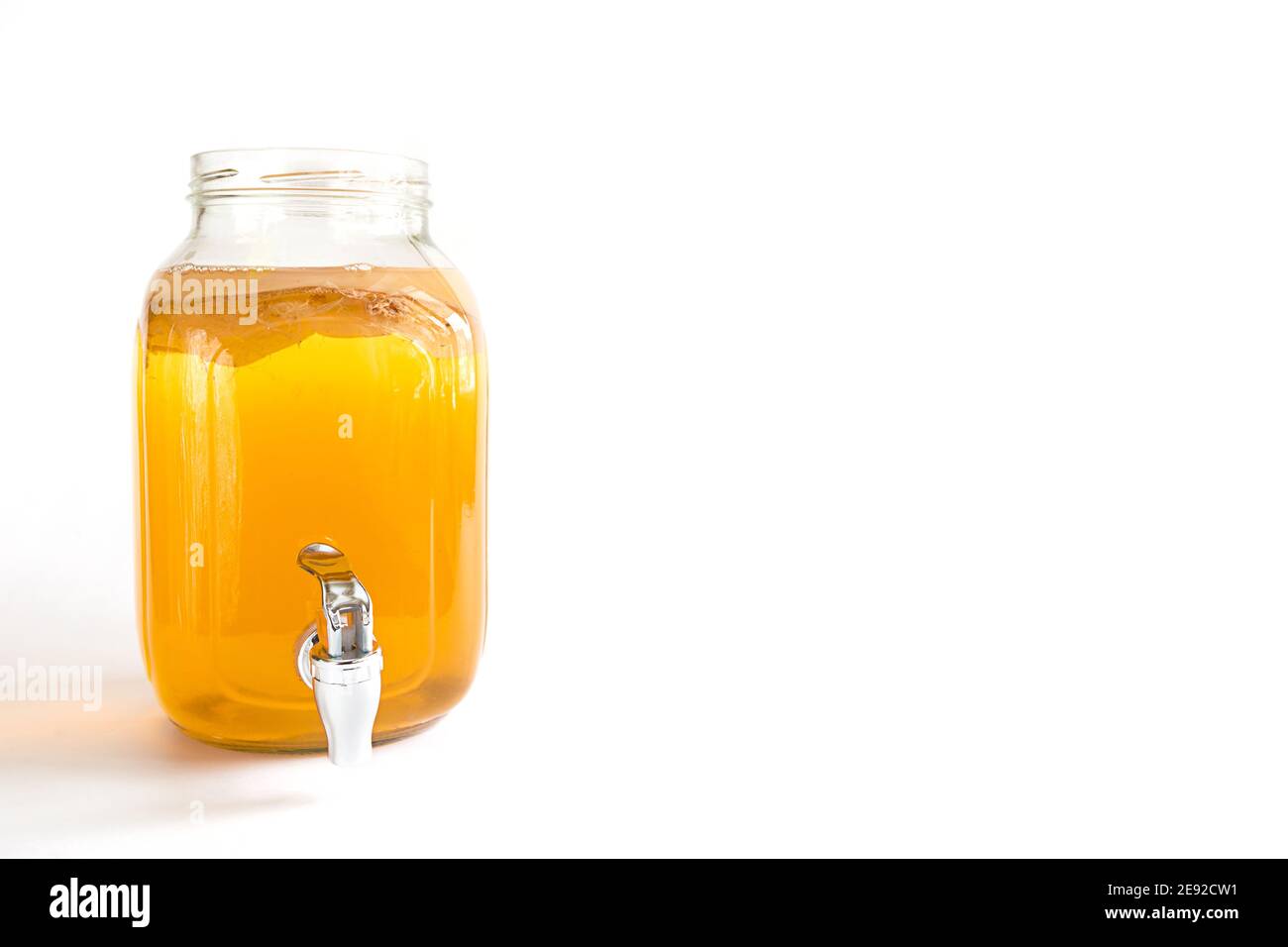 Kombuchaa drink made from tea mushroom in a glass jar with a tap