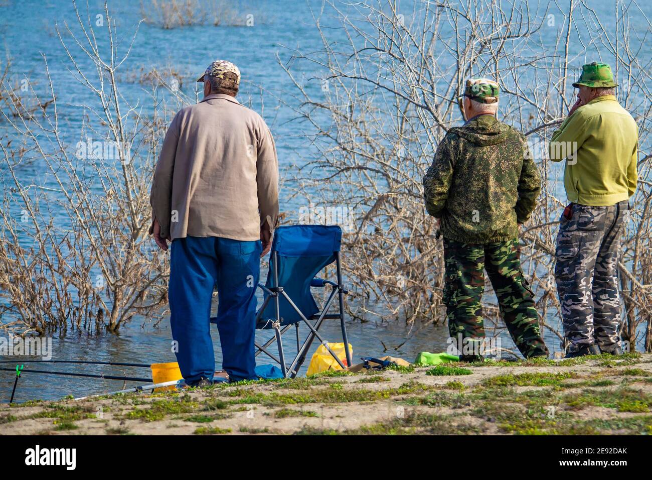 Lake. View from behind. Discussing fishing Stock Photo - Alamy
