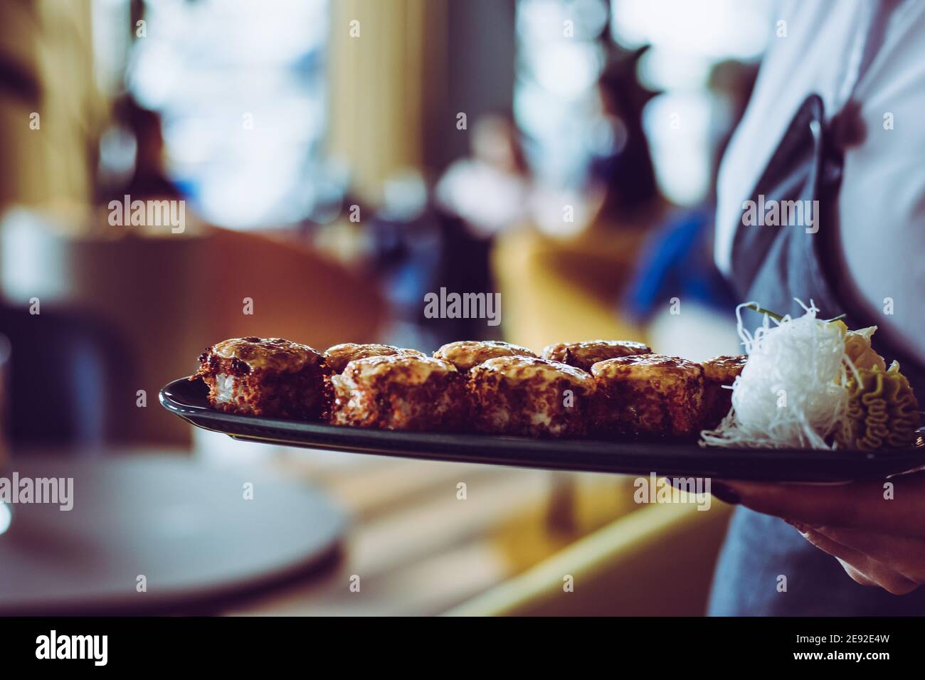 Maki and nigiri sushi variety with salmon, shrimp, avocado and tuna at a sushi restaurant Stock Photo