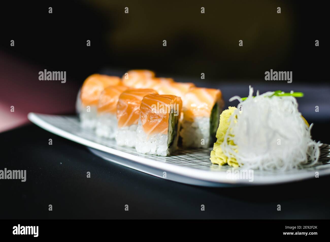 Maki and nigiri sushi variety with salmon, shrimp, avocado and tuna at a sushi restaurant Stock Photo