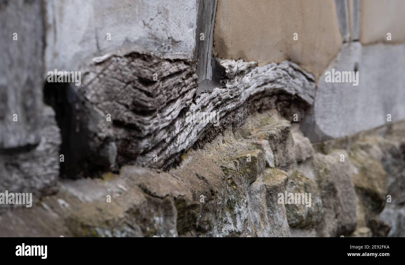 Close up of timber, stone and plaster on exterior wall of a Grade 2 listed building built in 17th (or possibly early 18th) century. Stock Photo