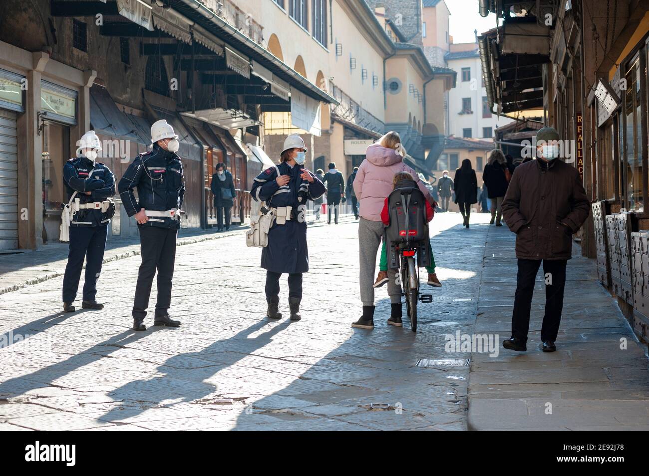 Florence, Italy - 2020, January 18: Scenes of city life in Florence, during Coronavirus pandemic. People walking on Ponte Vecchio. Police control. Stock Photo