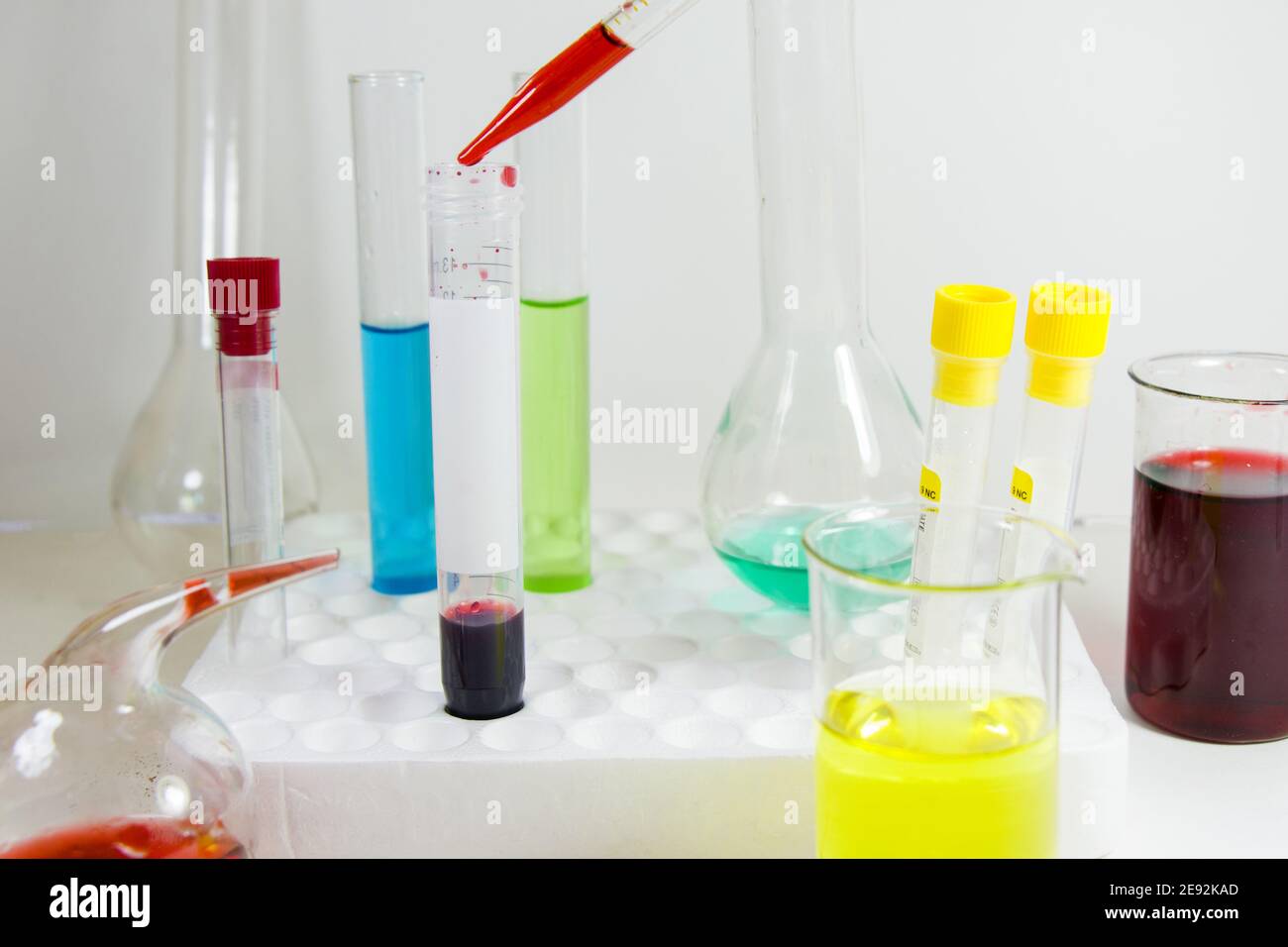 View of colorful laboratory chemical liquid elements on styrofoam test tube holder Stock Photo