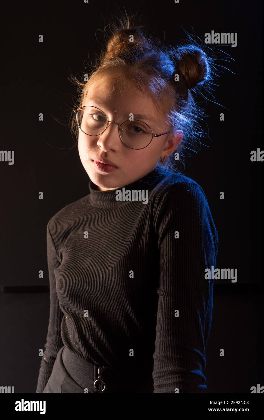 A teenager with a serious face. Focused teenager girl. Stock Photo