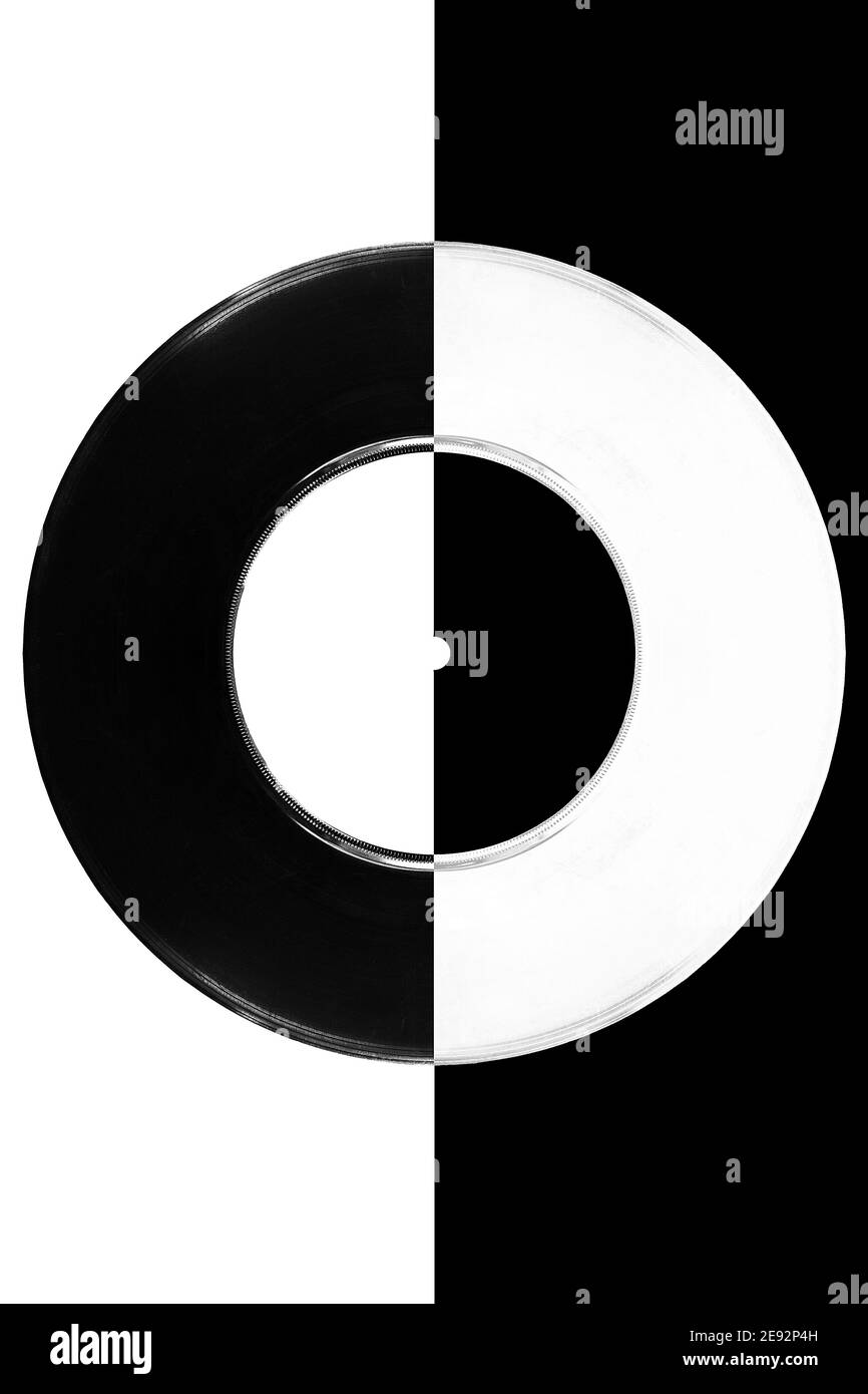 A ying yang style image of a vinyl record. One side black and one side