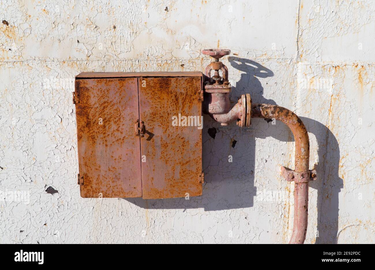 old and rusty fire cabinet with a crane. hydrant for water supply. fire ...