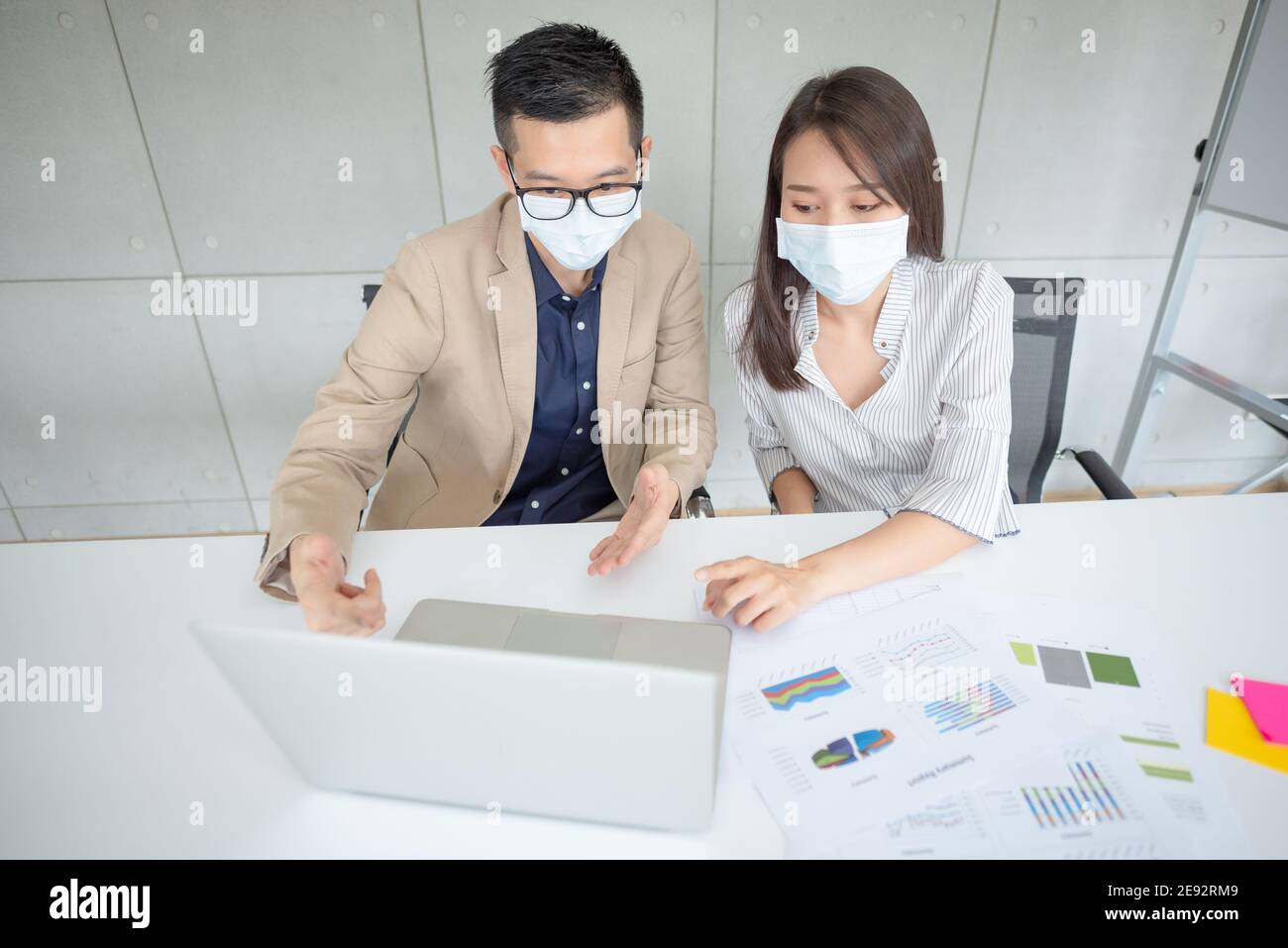 Business employees wearing mask during work in office to keep hygiene follow company policy.Preventive during the period of epidemic from coronavirus Stock Photo