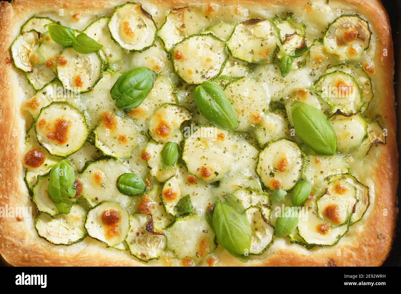 Close up of pizza with courgettes and mozzarella Stock Photo