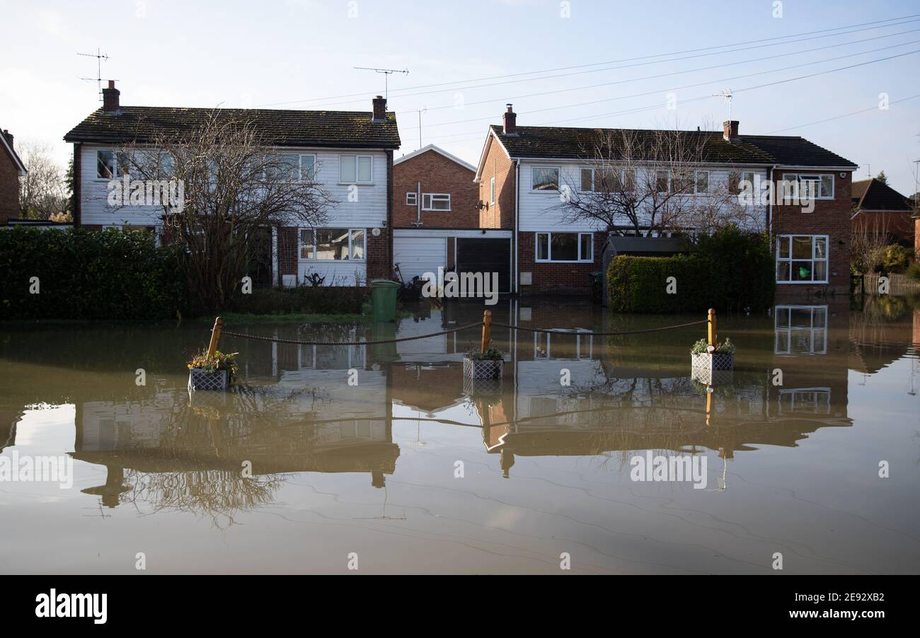 Floodwater from the river Thames surrounds houses on a street in Purley on Thames in Berkshire. Picture date: Tuesday February 2, 2021. Stock Photo