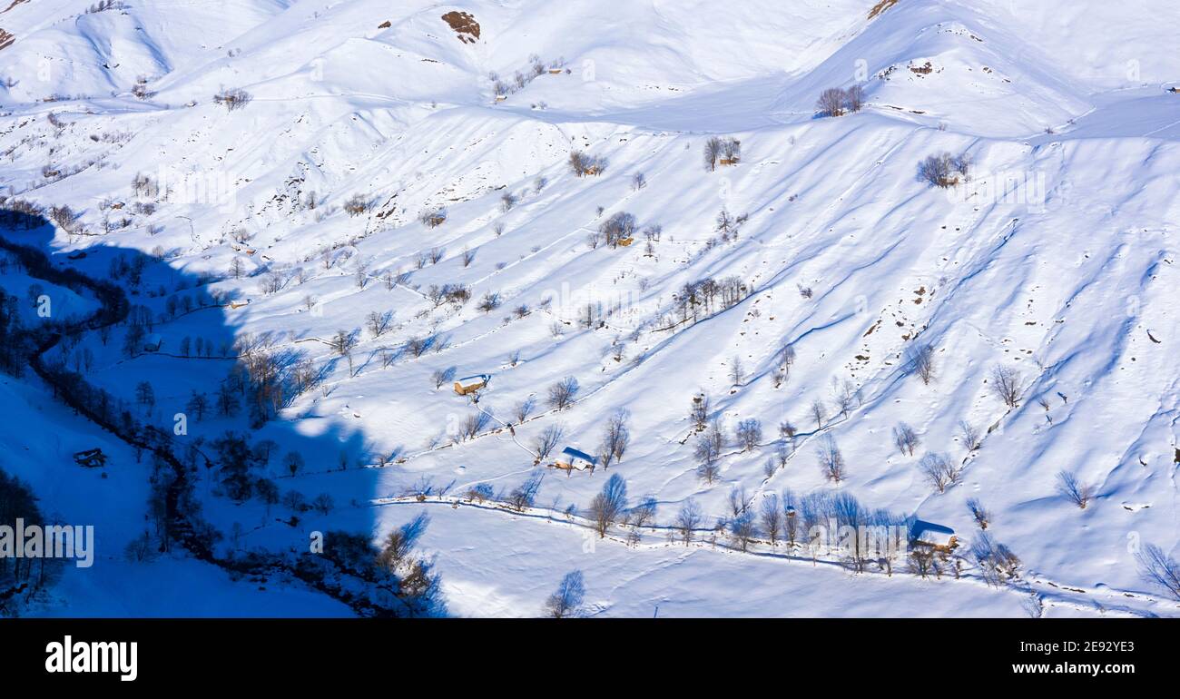 Pasiegas cabins in winter in the Valle del Miera in the Valles Pasiegos