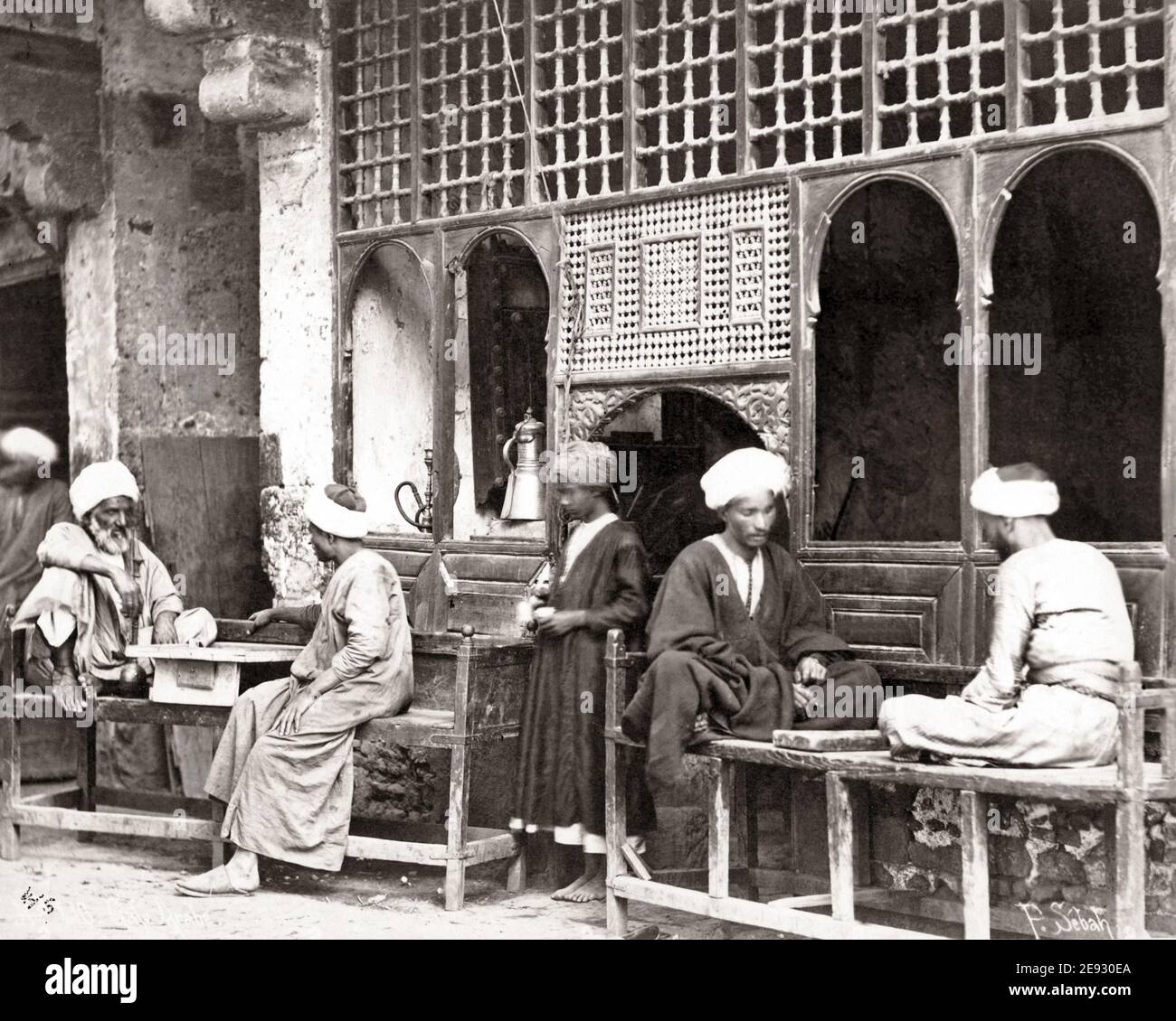Late 19th century photograph - Street Cafe, Egypt, men playing board games. Stock Photo