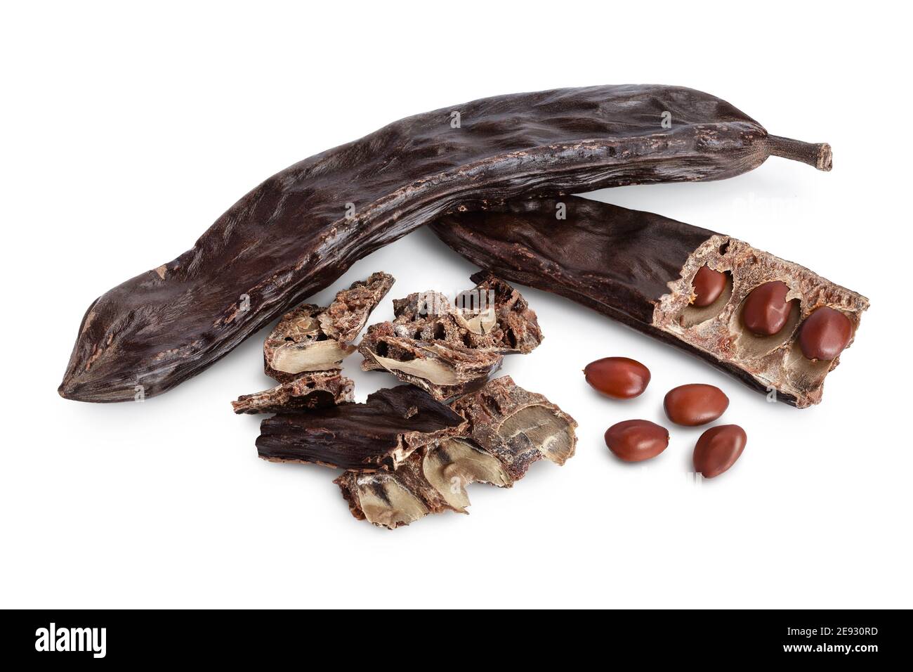 Ripe carob pods and bean isolated on white background with clipping