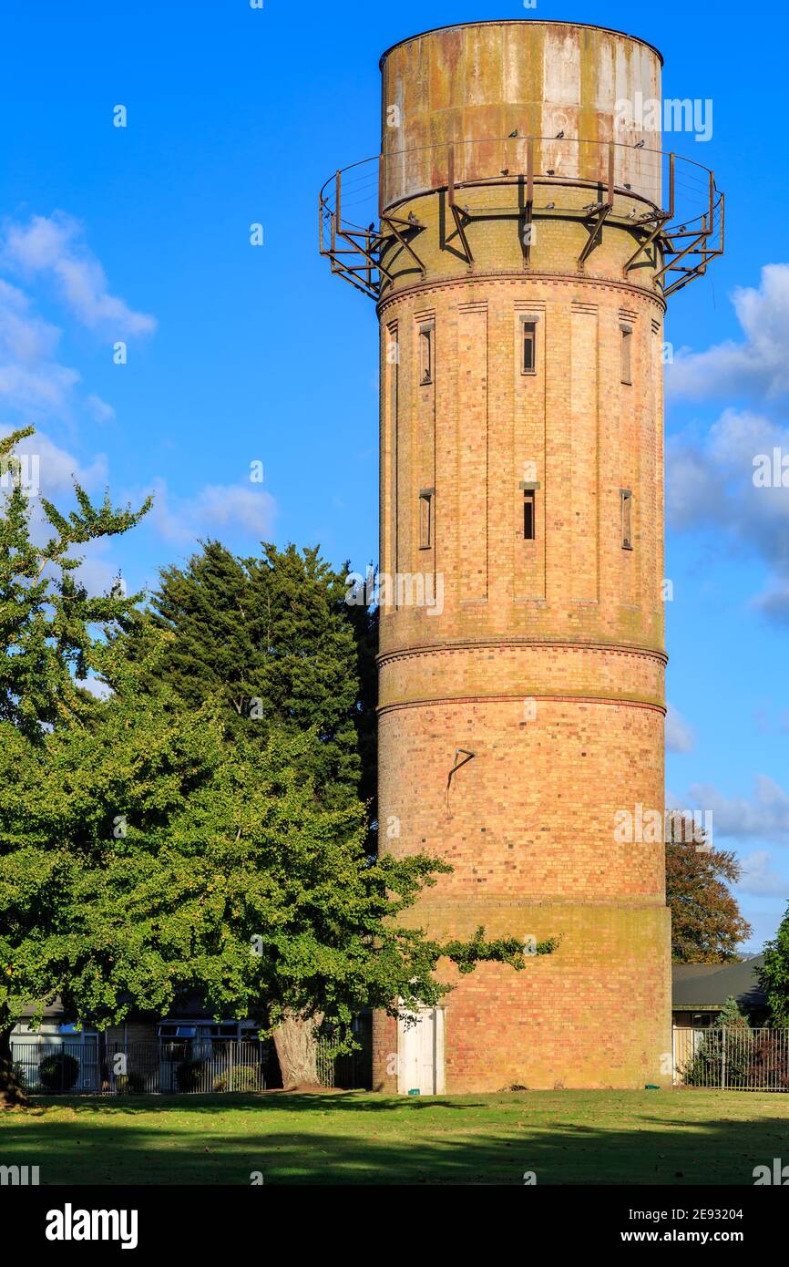 An old brick water tower, built 1903, in the town of Cambridge, New Zealand Stock Photo