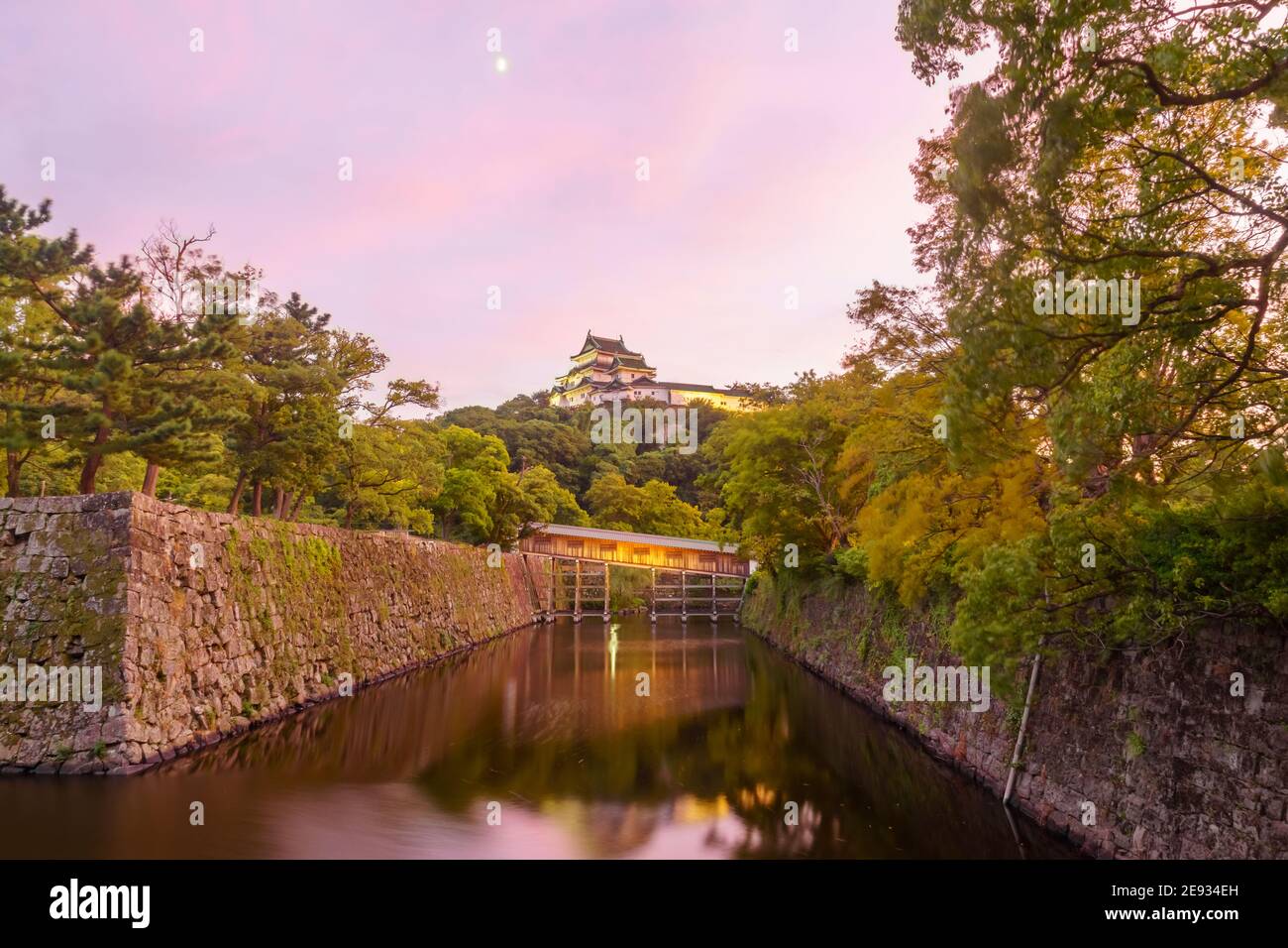 Sunset view of the Wakayama castle and the Ohashirouka Covered Bridge, in Wakayama City, Japan Stock Photo