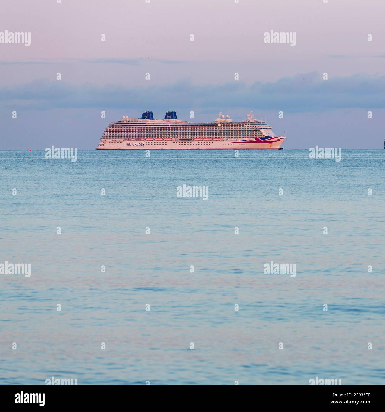 P&O Cruises' largest ship, Britannia, at anchor in Weymouth Bay. The cruise industry has suffered a complete shutdown during the covid-19 pandemic. Pi Stock Photo