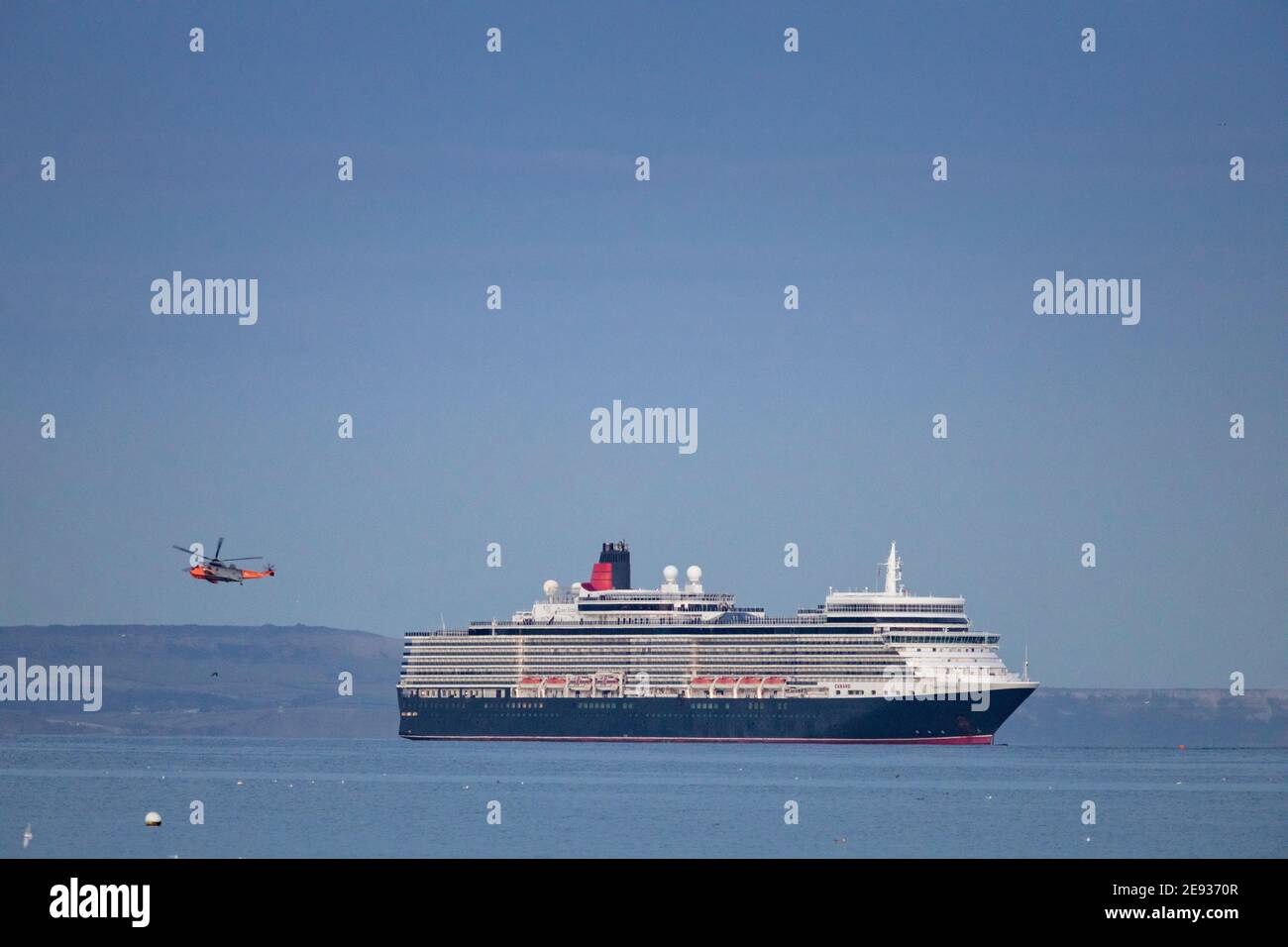 Cunard's Queen Elizabeth at anchor in Weymouth Bay. The cruise industry has suffered a complete shutdown during the covid-19 pandemic. Picture date Tu Stock Photo