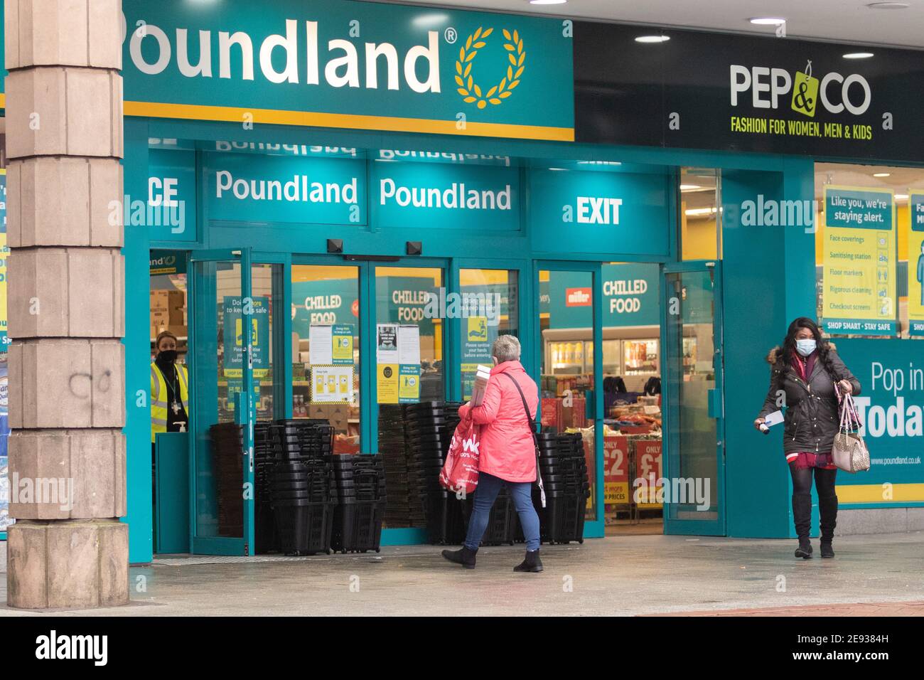 Walsall, West Midlands, UK. 2nd Feb, 2021. Local people in the town centre in Walsall - postcode WS2 - which has seen the South African variant of Covid 19 go about their daily business. On-the-spot doorstep tests and mobile testing units will be deployed in this area. Credit: Peter Lopeman/Alamy Live News Stock Photo