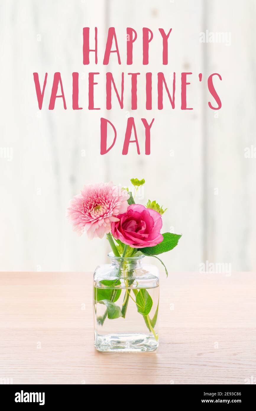 Flowers in a glass vase - Happy Valentines day Stock Photo