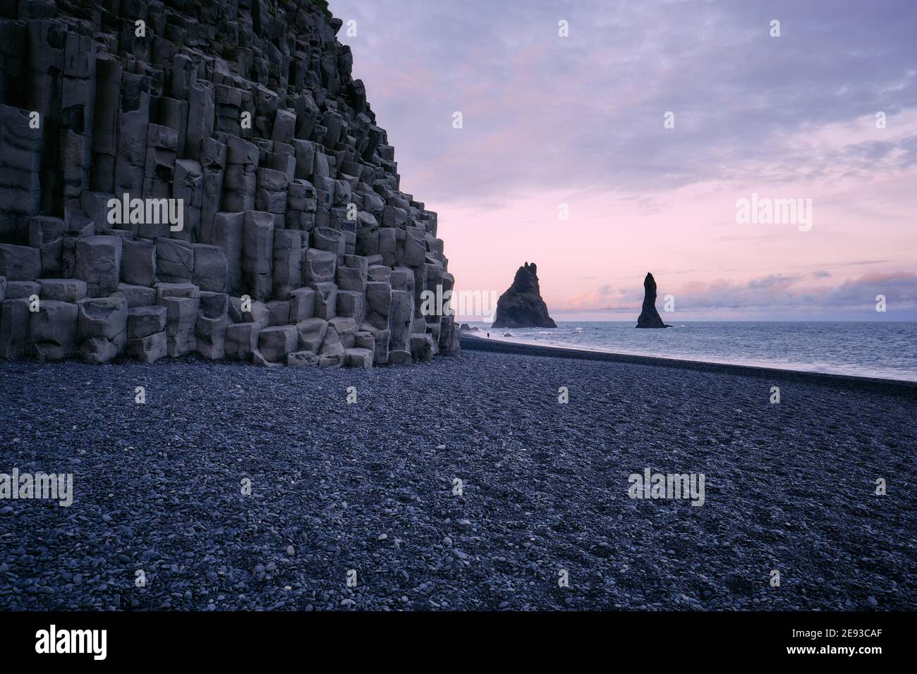 The black lava sand beach of Reynisfjara and the Reynisdrangar basalt ...