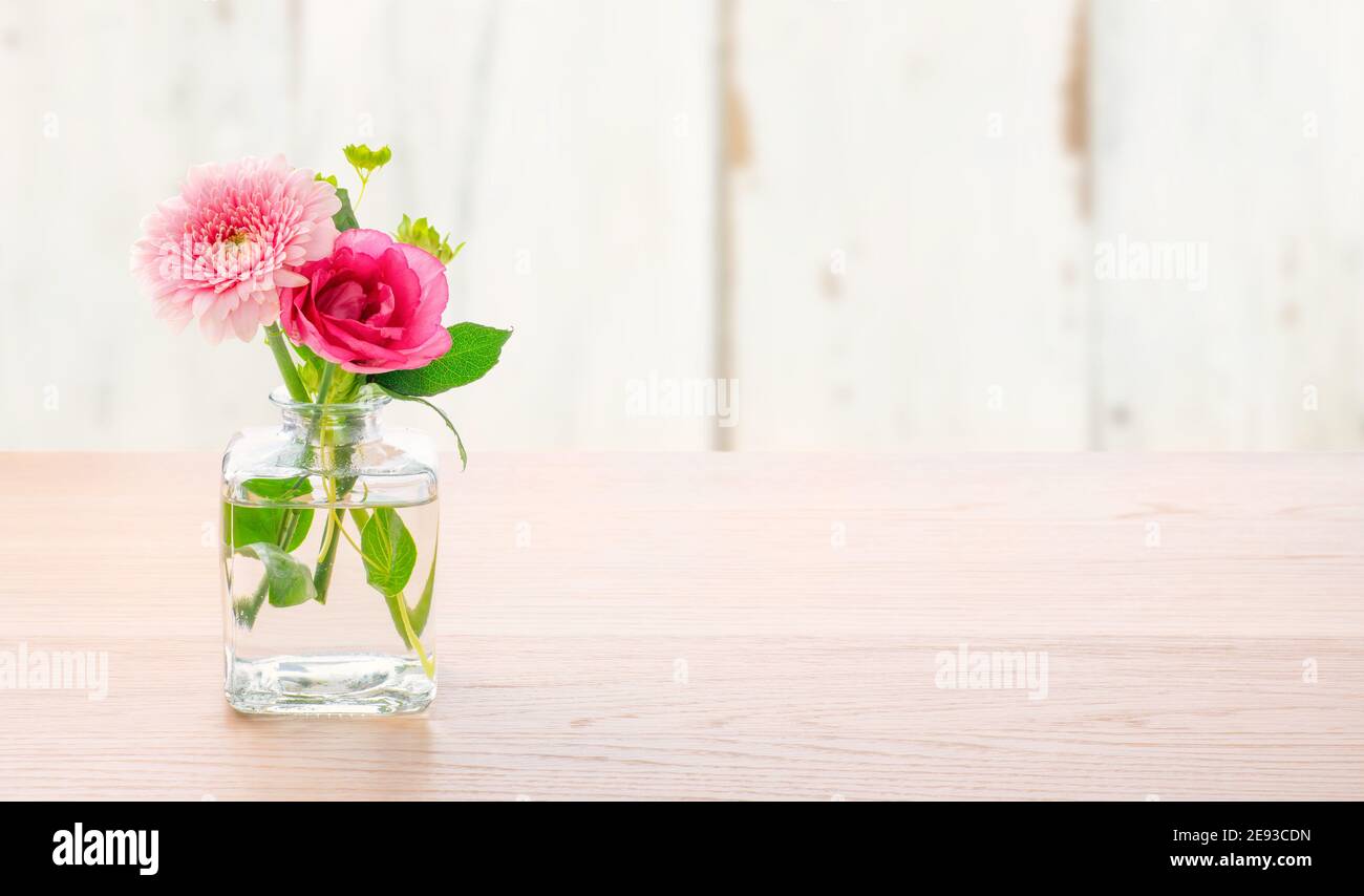 Flowers in a glass vase with copy space Stock Photo