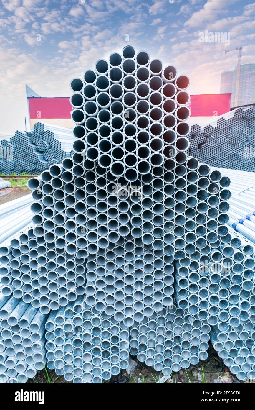 Steel Pipes Industry Construction stacked in Factory warehouse Stock Photo