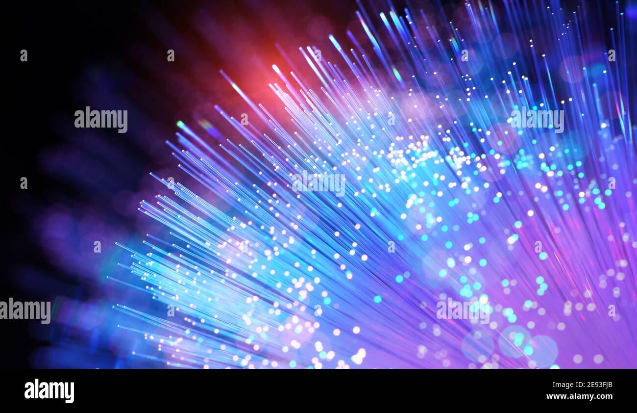 optical fibres dinamic flying from deep on technology background Stock Photo