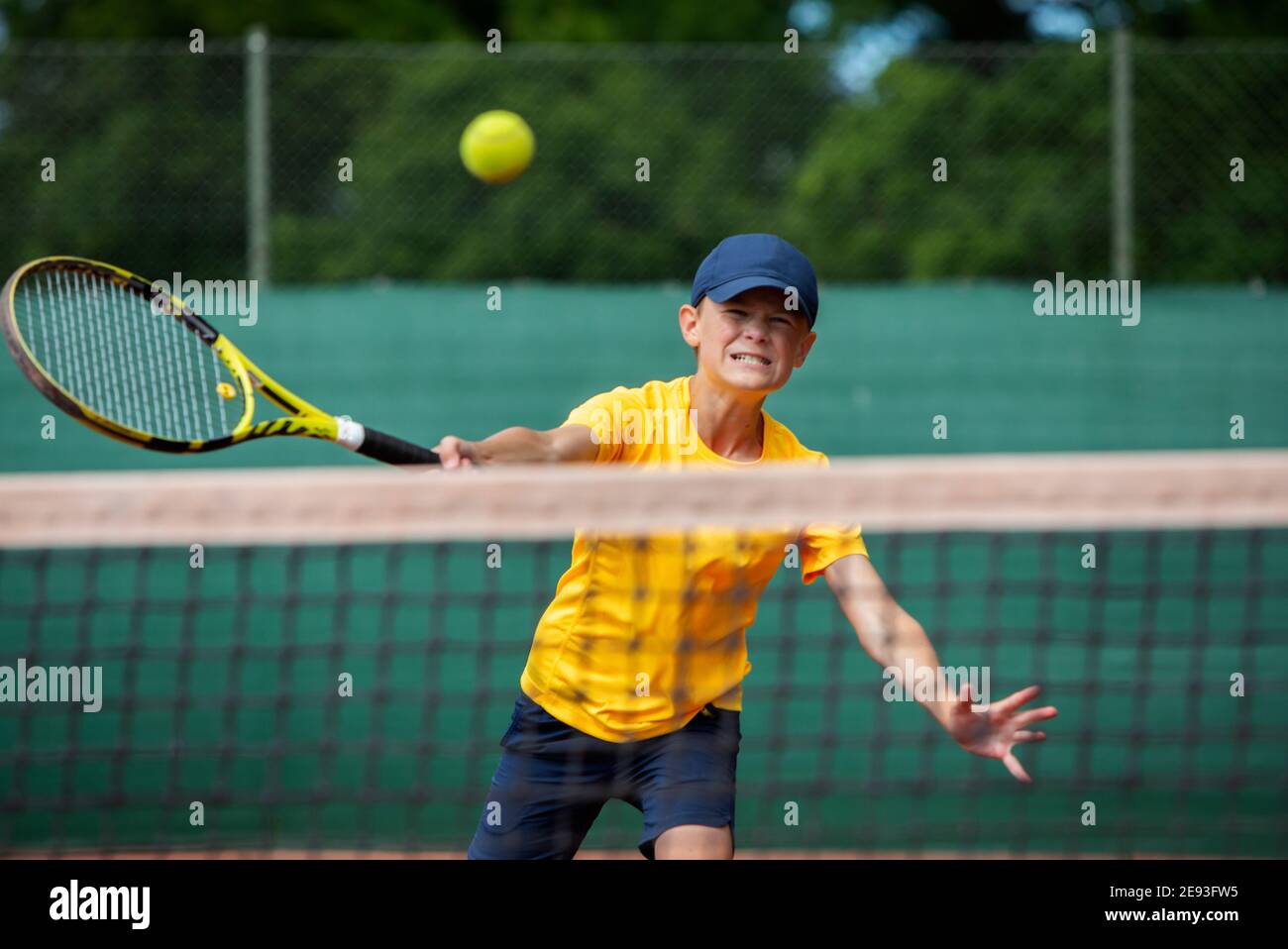 Boy playing tennis Stock Photo Alamy