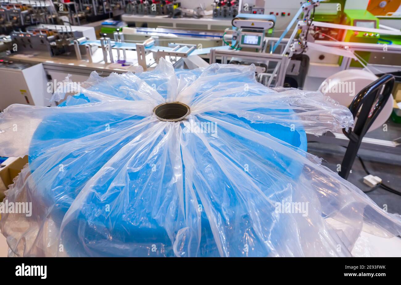 medical mask production line use of polypropylene as raw materials to manufacture melt blown cloth. Stock Photo