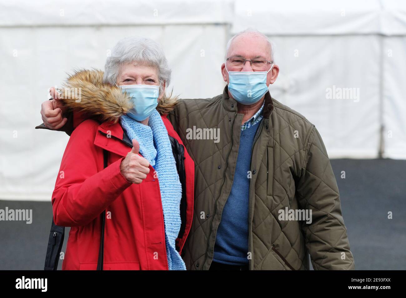 Ludlow, Shropshire, UK - Tuesday 2nd February 2021 - A new Covid 19 vaccination centre had opened today at Ludlow racecourse to provide coverage for the Shropshire, Telford & Wrekin area. Mr & Mrs Bytheway of Craven Arms ( both in their seventies ) give the thumbs up after receiving their first vaccinations. NHS, local council and members of the Royal Air Force have been administering the AstraZeneca vaccine on local residents. So far this area has had a relatively low number of vaccines administered in comparison to other regions. Photo Steven May / Alamy Live News Stock Photo