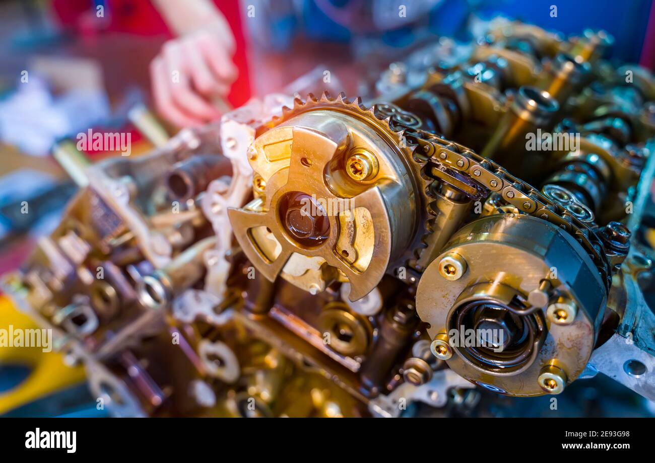 Hands with auto mechanic and engine parts close-up. Car service. Stock Photo