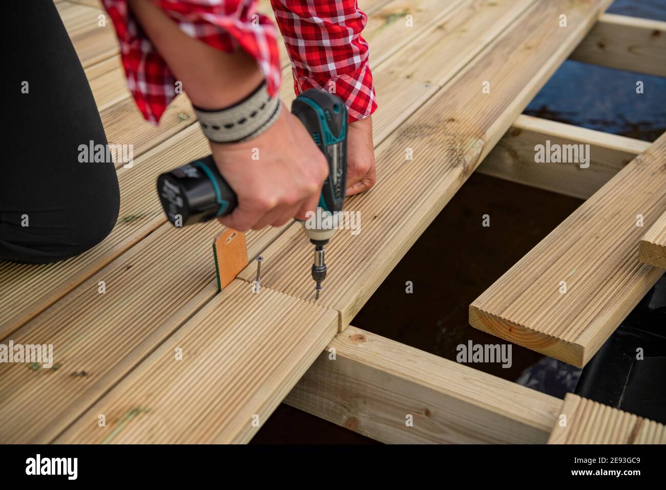 Womans hands using drill Stock Photo Alamy