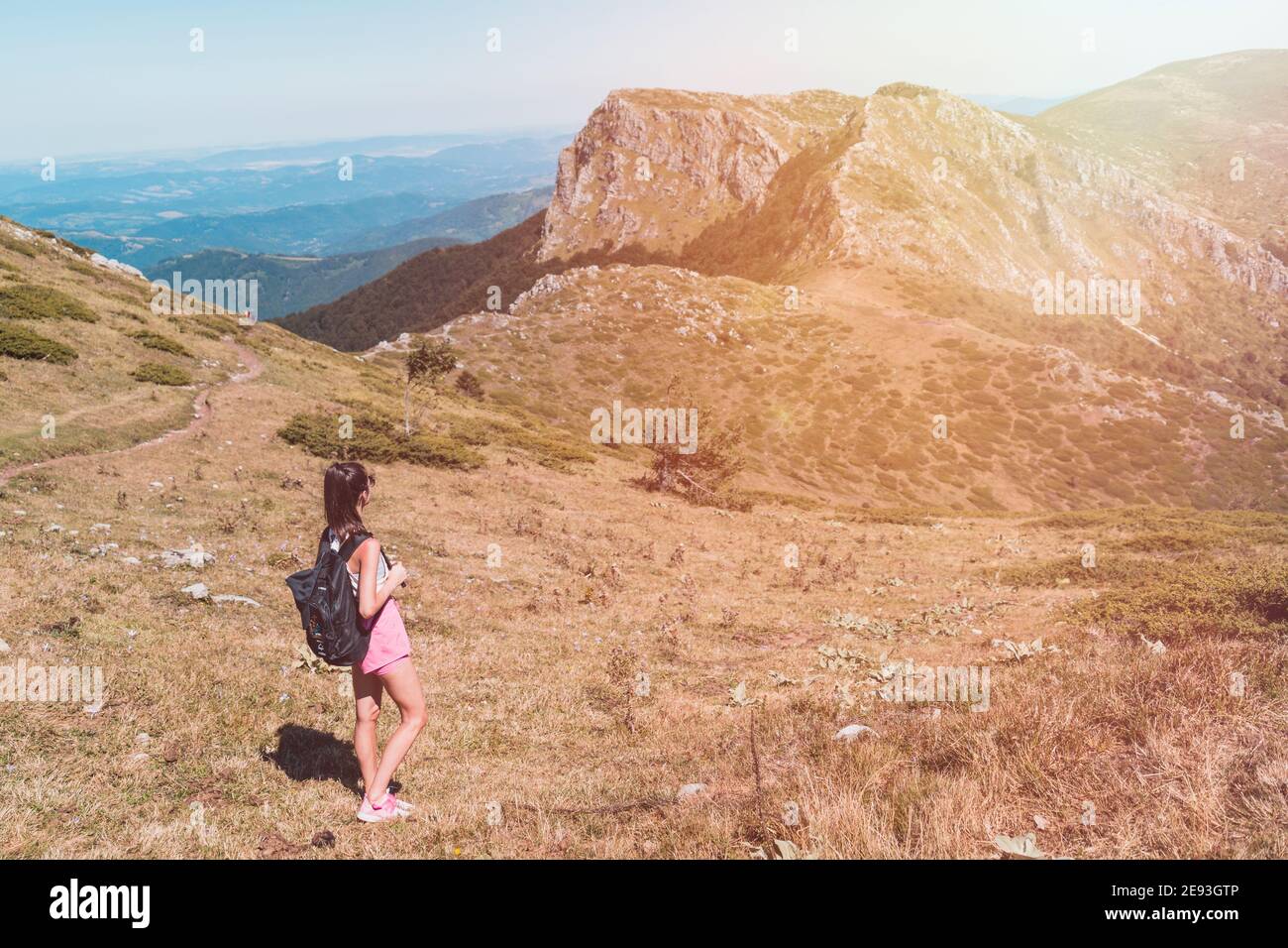 One woman mountain top success hi-res stock photography and images - Alamy