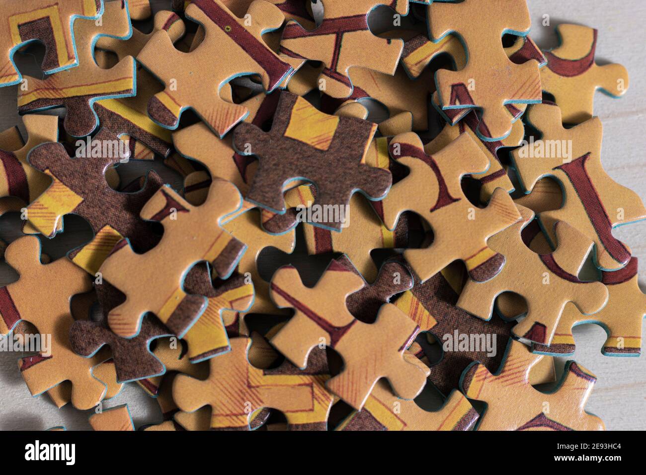 making a puzzle over a table Stock Photo