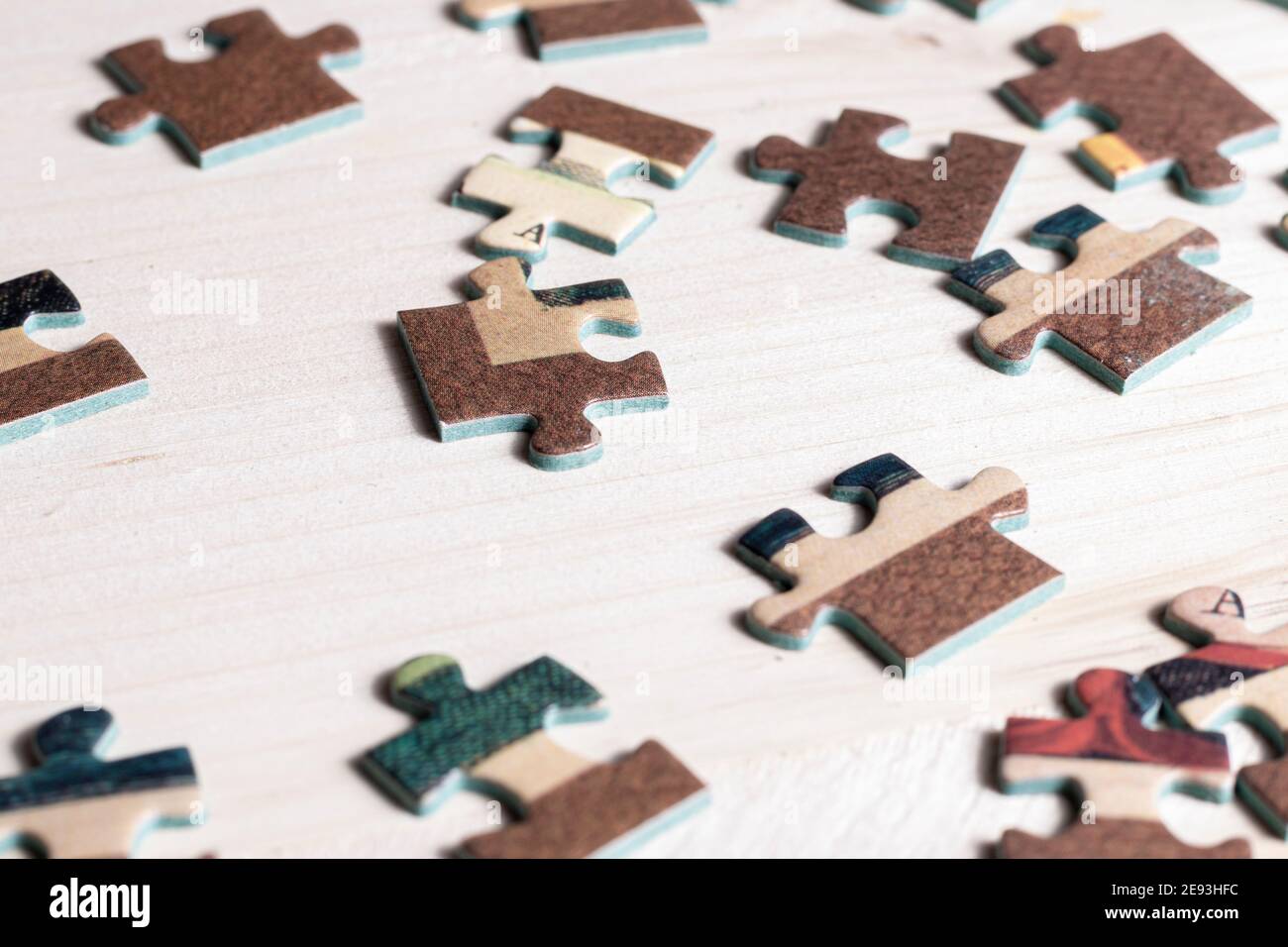 making a puzzle over a table Stock Photo