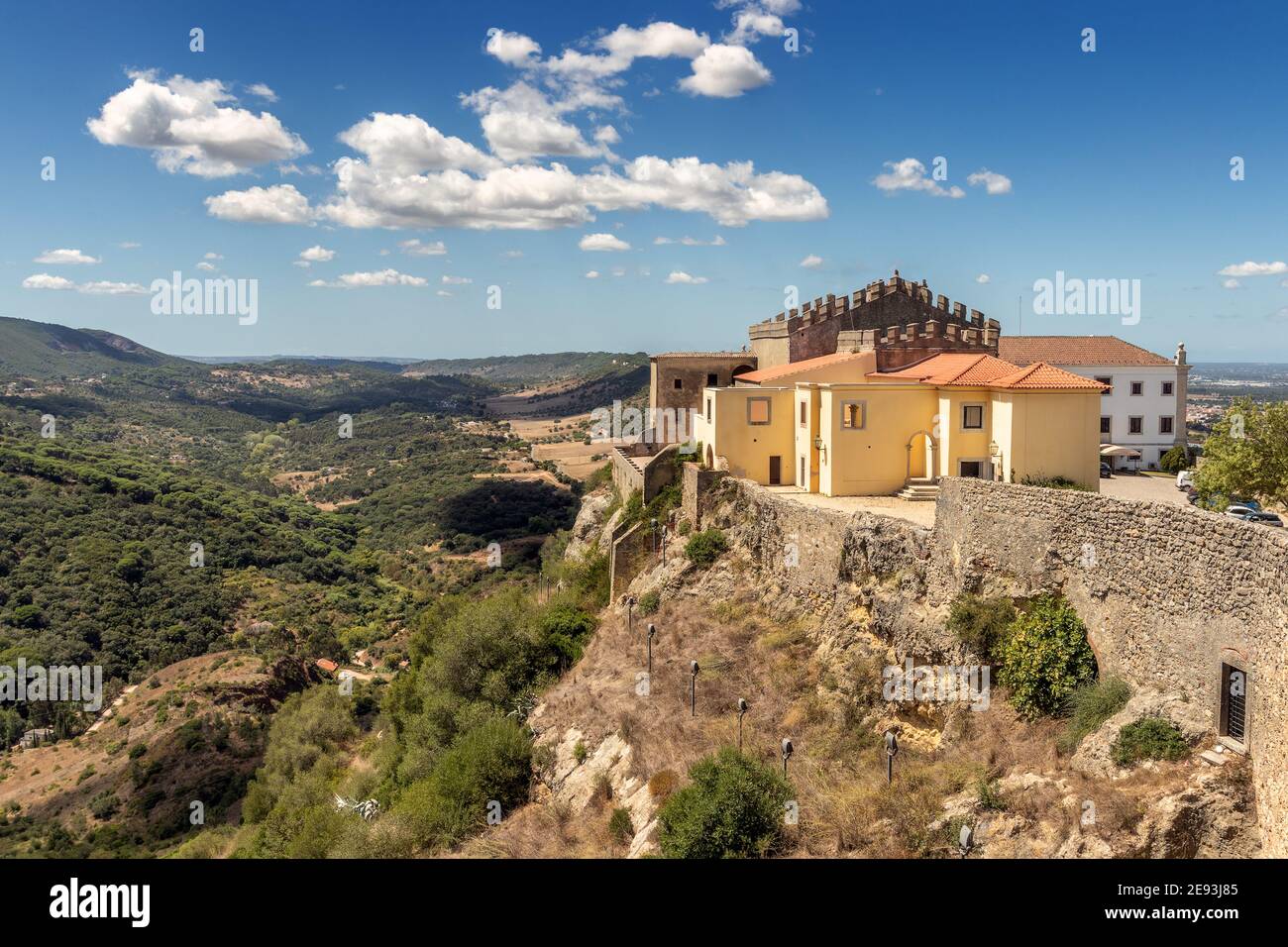 Beautiful landscape with the Church of Santiago and part of the castle of Palmela in the foreground and in the background the Serra da Arrábida. Stock Photo
