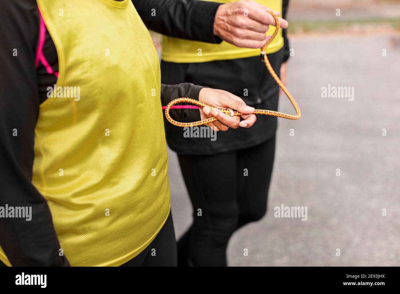 Visually impaired female triathlete running together with her guide Stock Photo Alamy