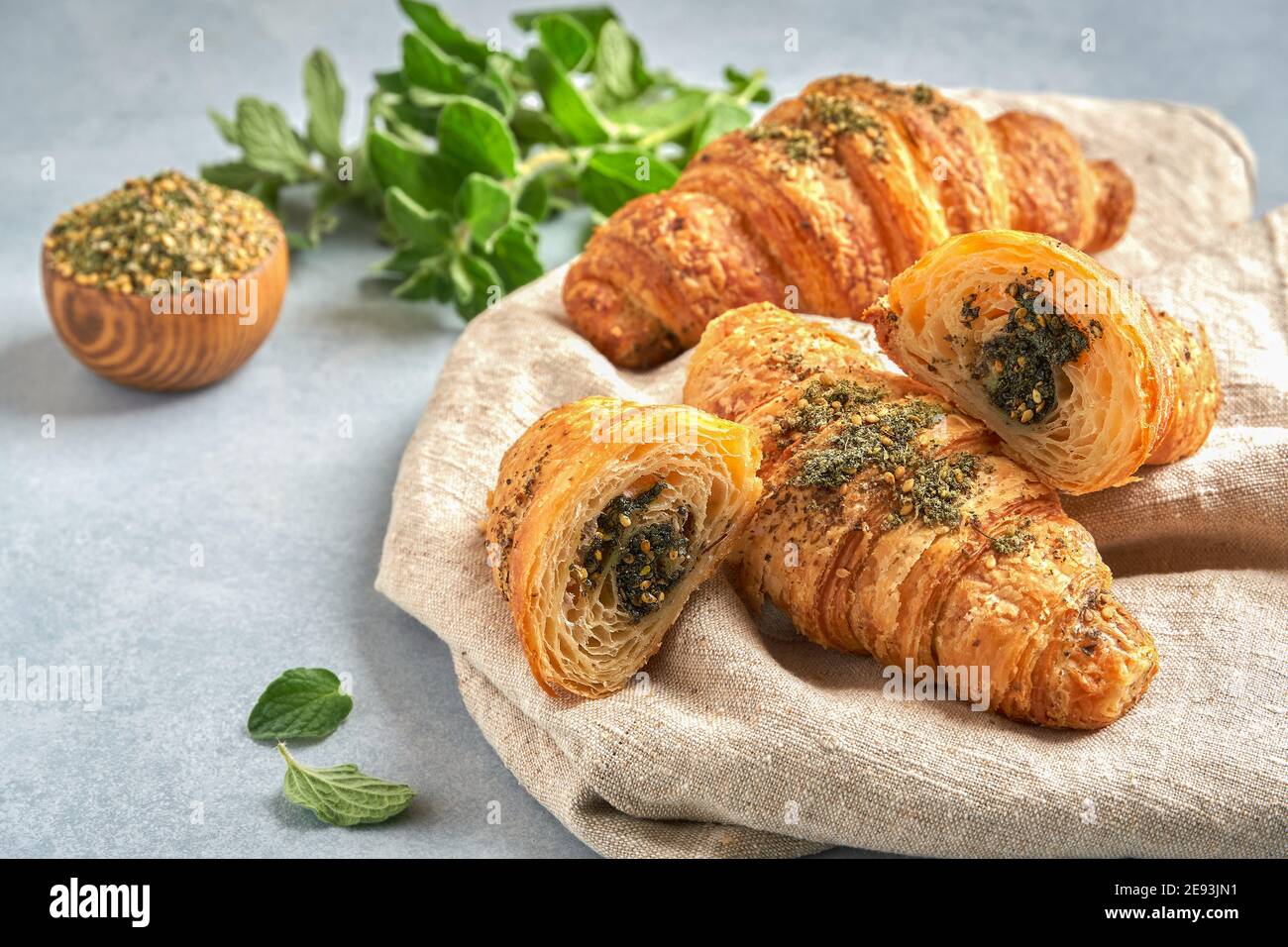 Croissants with zaatar on linen napkin . Closeup , copy space Stock Photo