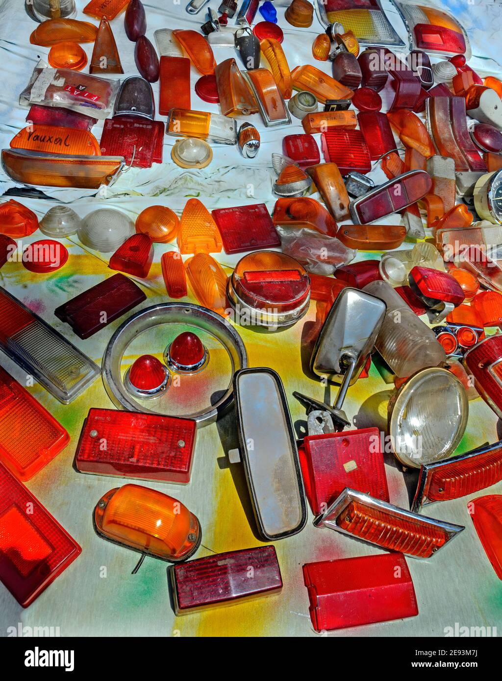 used orange and red transparent covers made from plastic for car lights Stock Photo
