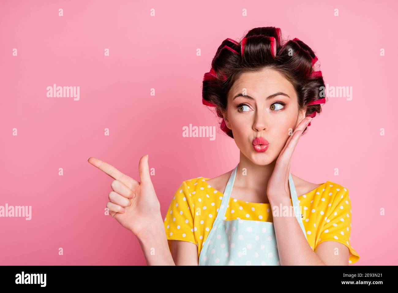Portrait of astonished girl touch hands face point index finger ...