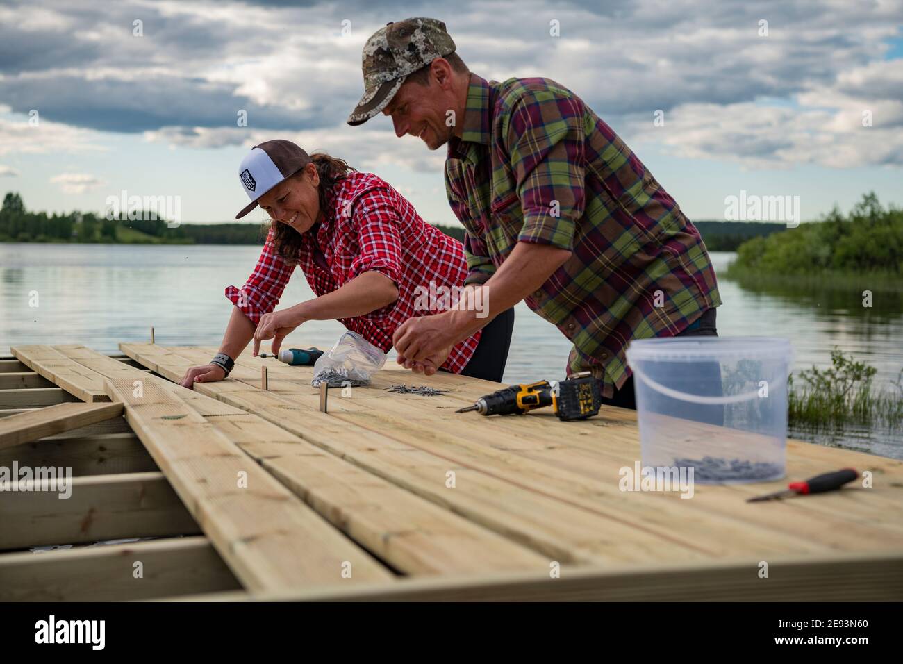Smiling couple doing carpentry Stock Photo