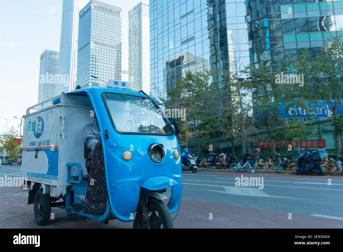 Work on the way driving tricycle Courier Stock Photo
