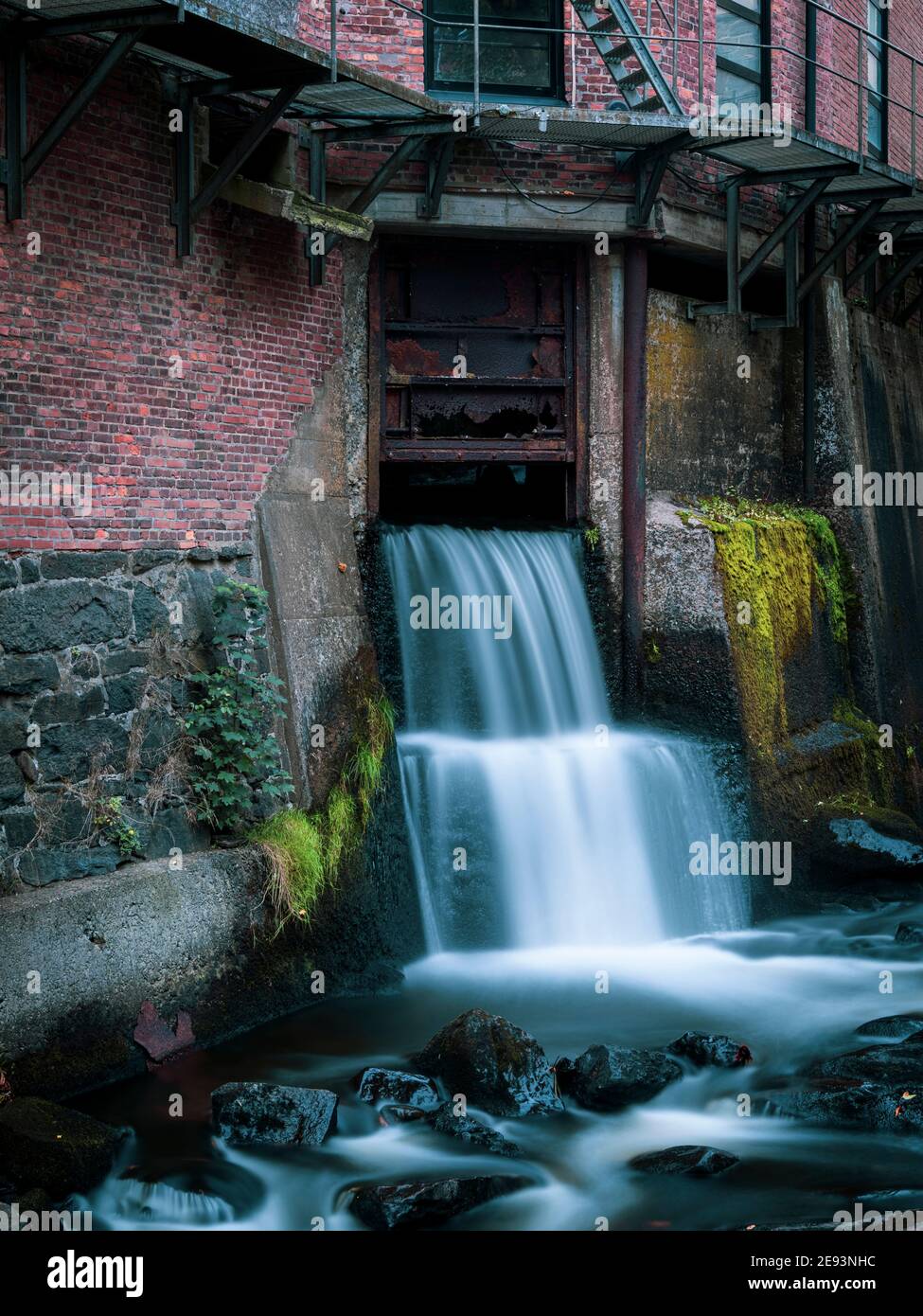 Urban waterfall in old industrial area, Kvarnbyn near Molndal, Sweden Stock Photo