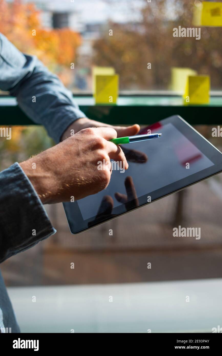 Businessmans hands using digital tablet Stock Photo