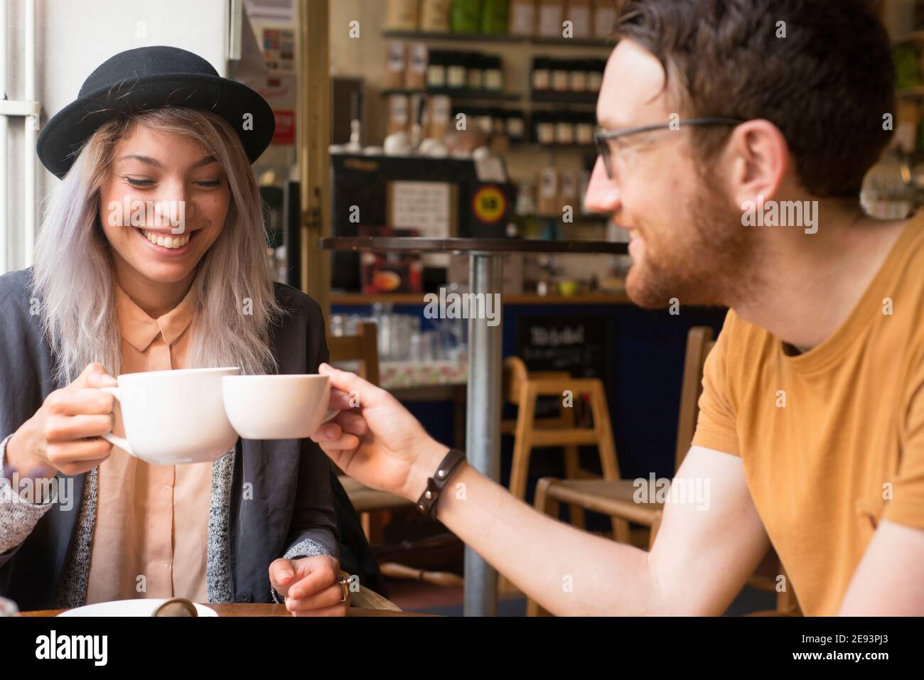 Couple having coffee in cafe Stock Photo