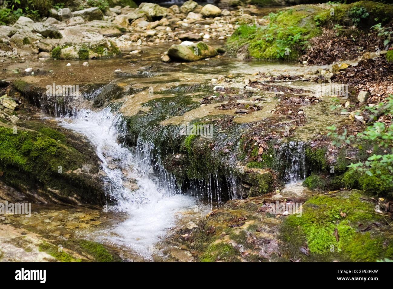Waterfall flowing over dark rock hi-res stock photography and images ...