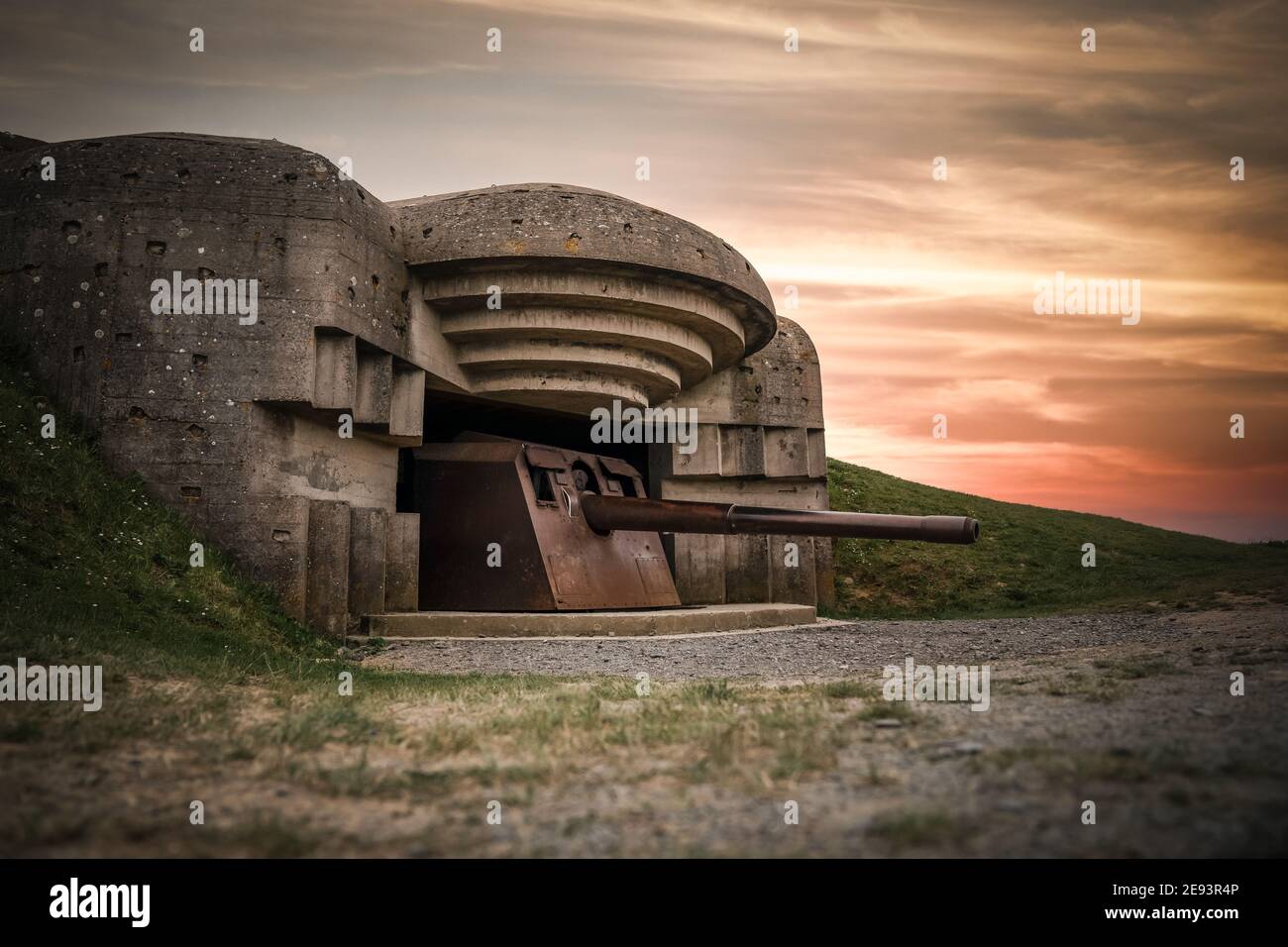 Atlantic wall concrete German World War Two 2 gun emplacement fortification bunker battery at Longues-sur-mer in Normandy Gold Beach France remains Stock Photo