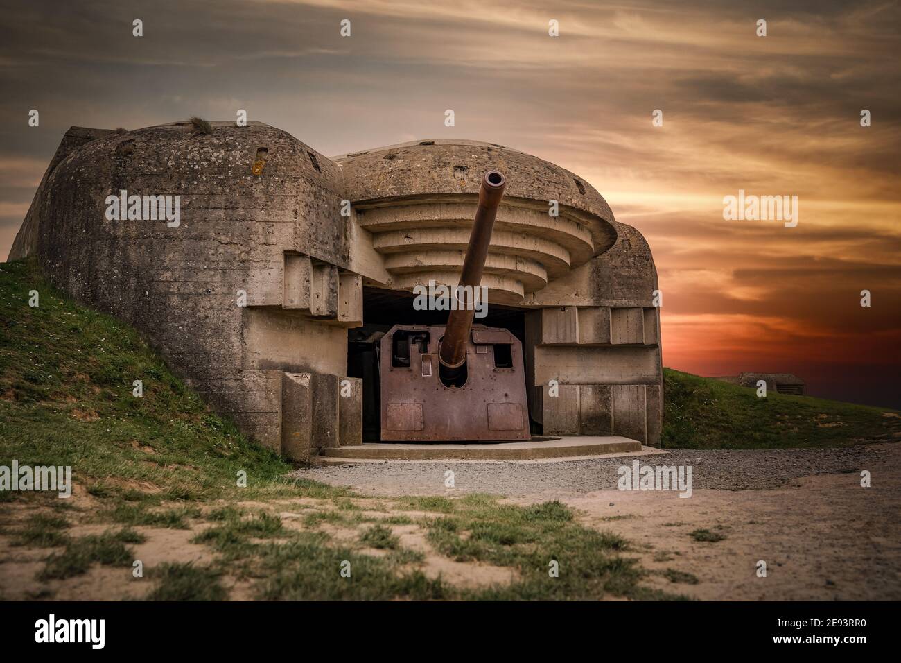 Atlantic wall concrete German World War Two 2 gun emplacement fortification bunker battery at Longues-sur-mer in Normandy Gold Beach France remains Stock Photo