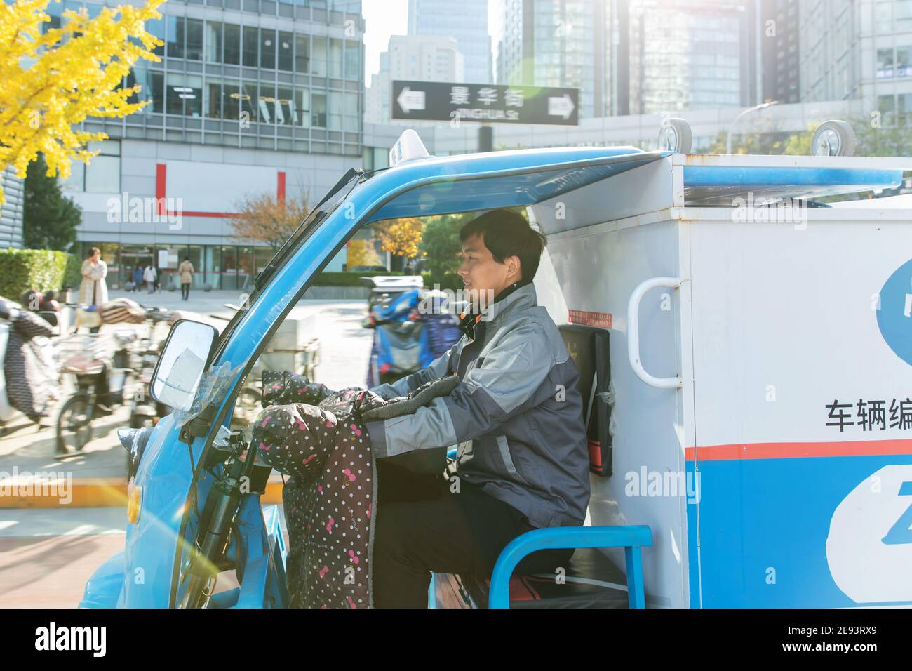 Work on the way driving tricycle Courier Stock Photo