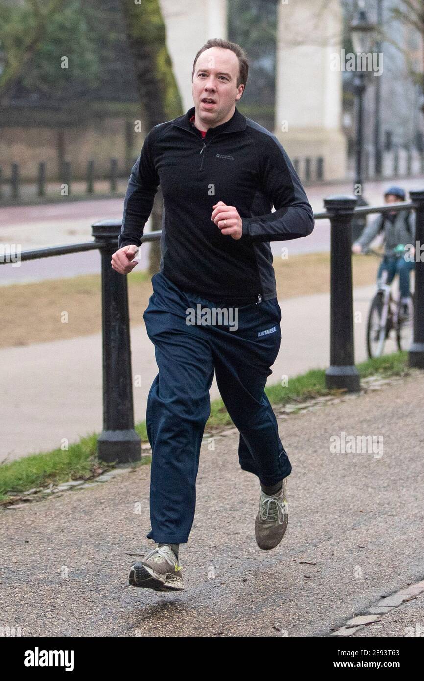 Health Secretary and cabinet minister Matt Hancock jogs through Green Park, Central London towards his office on the 1st of February  2021 Stock Photo