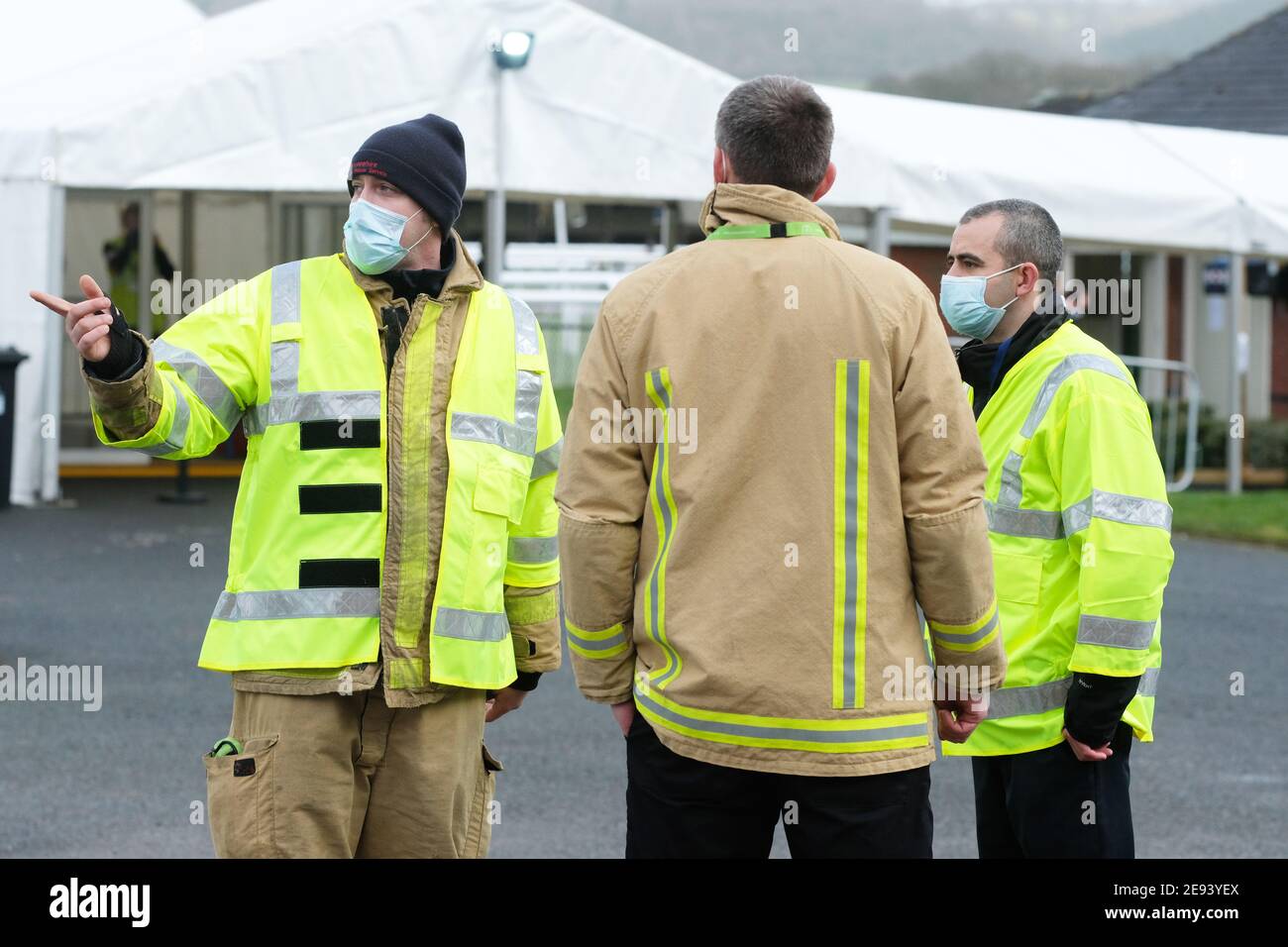 Ludlow, Shropshire, UK - Tuesday 2nd February 2021 - Members of the Shropshire Fire and Rescue service help to staff and organise a new Covid 19 vaccination centre at Ludlow racecourse. This new centre will provide coverage for the Shropshire, Telford & Wrekin area. Photo Steven May / Alamy Live News Stock Photo